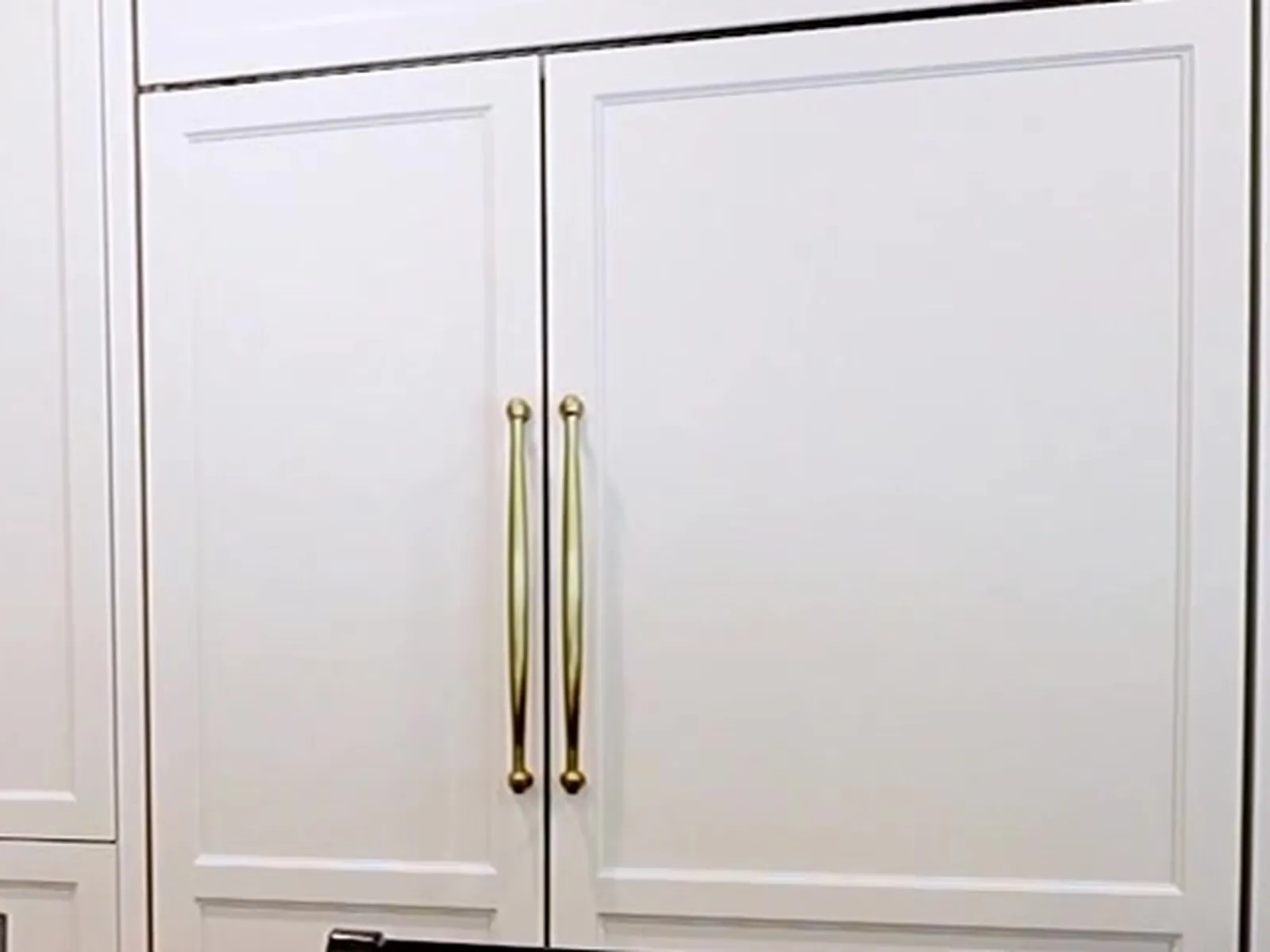 Close-up of gold cabinet pulls — White Fox Cabinets